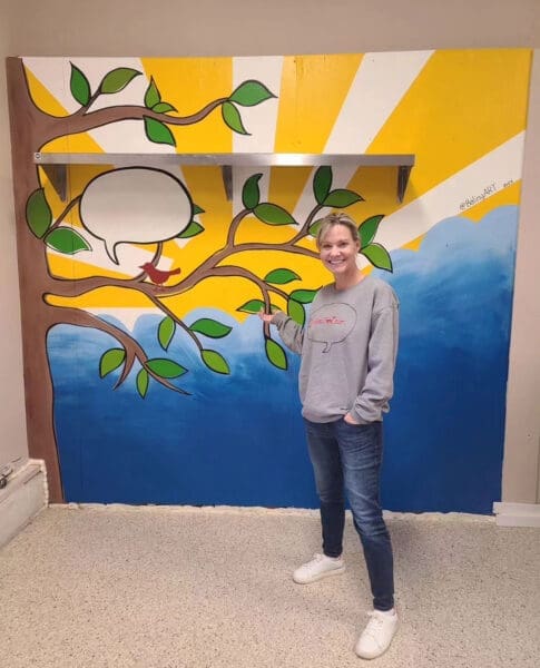 Jeanne in front of mural